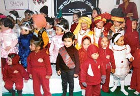 Students of Tiny Tots Preparatory School, Sector 38, during Christmas celebrations in the school in Chandigarh on Thursday. 