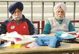 Flight Lieutenant Amarjit Singh (right) and Mr Gurcharan Singh Nabha, members of the technical committee of the SN Vohra's All-India Gurmit Memorial Hockey Tournament. 