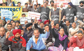 UT government teachers stage a dharna at Matka Chowk in Chandigarh on Friday. 