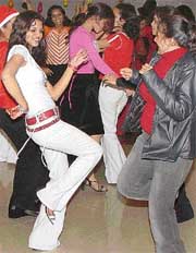 Students of NIFD celebrate in a dance party on the eve of Christmas in Mohali on Saturday. 