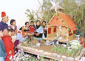 Residents of Bhurewal village sing carols at the Nitya Sahayak Church on Saturday. 