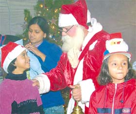 MERRY CHRISTMAS: Santa Claus shares his gifts with children in Jalandhar on Christmas eve
