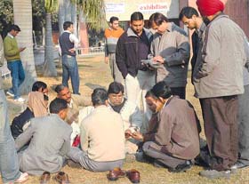 Coin dealers and collectors on the Panjab University grounds in Chandigarh