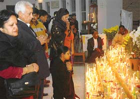 Devotees pray on the occasion of Christmas at the Sector 19 church in Chandigarh