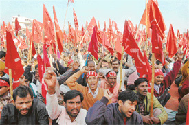 Members of various labour unions hold a rally in Ludhiana on Sunday