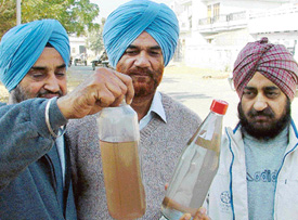 Residents of Dugri, Phase I, show dirty water callected from taps at their homes