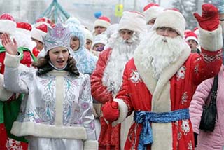 Several hundred Belarussians dressed at Father Frost, equivalent to Santa Claus, and Snow Maiden march in central Minsk