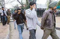 The accused coming out of local courts in Sector 17, Chandigarh, on Tuesday. 