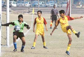 Kerala and Maharashtra players in action during their match in the All-India Football Federation under-14 Soccer Festival at the Punjab Engineering College grounds in Sector 12, Chandigarh, on Tuesday. 