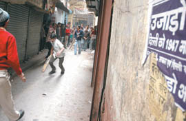Residents playing cricket on an empty street in Sadar Bazar during the traders strike to protest against the ongoing demolition drive against unauthorised constructions in the Capital.