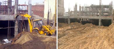 A bulldozer tries to raze an illegal structure belonging to a transporter  and the building stands erect after the demolition squad left in Ludhiana on Tuesday