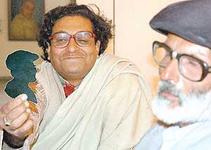 Prabal Pramanik makes a paper cut of K. Kumar