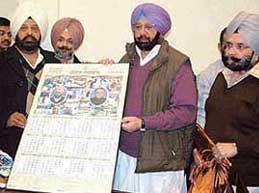 The Punjab Chief Minister, Capt Amarinder Singh, releases the Punjab Government calendar for 2006 in Chandigarh on Tuesday. Also seen in the picture are Excise and Taxation Minister Sardul Singh and Adviser to the Chief Minister B.I.S. Chahal.