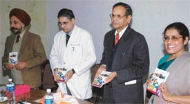 Prof B.N.S. Walia, Prof K.K. Talwar and Prof K.N. Pathak release the books of Chetana Vaishnavi at the PGI in Chandigarh on Wednesday