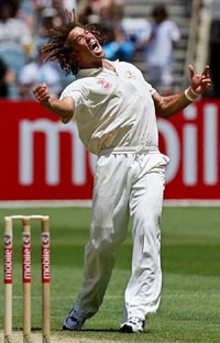 Australias Andrew Symonds celebrates after taking the wicket of South Africas Mark Boucher during the third day of the second Test in Melbourne