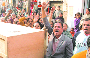 Relatives carry the body of Jatinder Singh, a youth who was killed in Philippines recently, for cremation in Jalandhar on Friday. They also demanded the arrest of the culprits in the case.