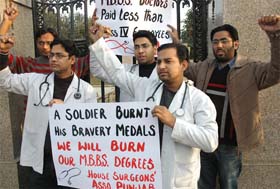 Doctors hold a protest against vacant posts of House Surgeon in government hospitals in Punjab on Mall Road in Patiala