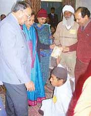 The Punjab Governor, (Retd) Gen S.F. Rodrigues and Ms Jean Rodrigues interact with physically challenged