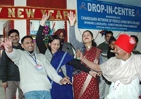 The four dancing persons in the front row, all HIV positive, celebrate New Year in Chandigarh on Monday.