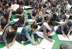 Students participate in a painting contest organised by the Chandigarh Traffic Police at the Sector 23 Children Traffic Park, Chandigarh, on Monday. 