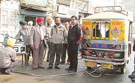 District Transport Officer Kuldeep Singh oversees checking of autorickshaws for pollution emission in Ludhiana on Monday