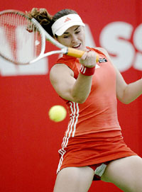 Former world number one Martina Hingis of Switzerland hits a return to Maria Vento-Kabchi of Venezuela during the first round of the Australian Womens Hardcourt Tennis Championships on the Gold Coast on Monday. 
