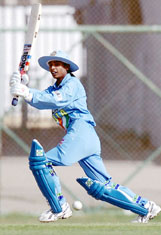 Indian womens cricket team captain Mithali Raj hits a boundary off a Pakistani bowler during their last league match in the Womens Asia Cup at the National Stadium in Karachi 