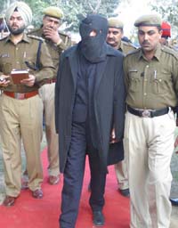 Murder accused Sukhbir Singh, an NRI, in the custody of the Jalandhar police on Tuesday. 