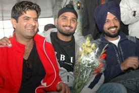 Cricketer Harbhajan Singh is all smiles during the launching of Gori, a music album of his friend Teji Sandhu (left). Also seen in the picture is comedian Gurpreet Ghuggi. 