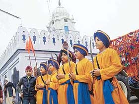 Panj Pyaras lead a religious procession in connection with Guru Gobind Singh's birthday in Mandi Ahmedgarh