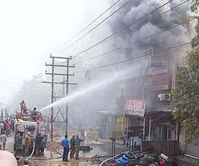 Firemen fight the flames at a tyre company in Ludhiana