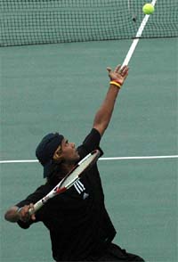 Top seed Rupesh Roy of India ready to serve during ITF Junior (Grade 3) Tennis Tournament at CLTA Stadium in Sector 10
