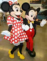 Disney cartoon characters Minnie and Mickey Mouse pose during a promotional campaign in Mumbai on Wednesday. The campaign is part of a launch program of Nerolac Disney, a product range of emulsion pack to decorate childrens rooms. Nerolac-Disney is a royalty association between Disney Consumer Products and Goodlass Nerolac Paints Ltd.