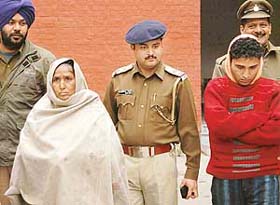 Bachani and her son Slamudeen in police custody at the Sector 26 police station, Chandigarh