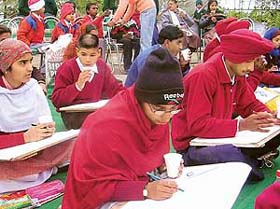 Students of different schools participate in a painting competition at Nadiali village