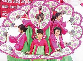 Students of Jeong Myung Girls High School Mokpo, South Korea, perform a dance at Paragon Senior Secondary School, Sector 71, Mohali