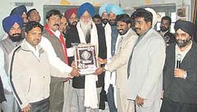 SGPC president Avtar Singh being honoured at a Municipal Karamchari Dal function in Ludhiana