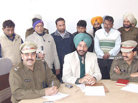 DIG PS Sarao (centre) addresses a press conference in Bathinda on Wednesday. Standing behind him are the arrested bookies. 
