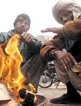 People warming up their hands in the Capital on Thursday.