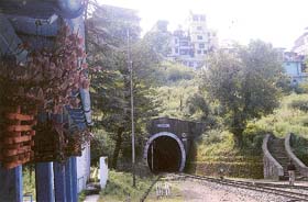A multi-storied structure on top of tunnel No 10 at Kumarhatti Railway Station threatens the Kalka-Shimla railway track