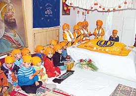 Tiny tots at Kiddies Paradise recite shabads on the occasion of Guru Gobind Singhs birth anniversary in Ludhiana on Thursday. 