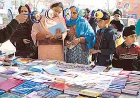 People evince keen interest in religious books and calendars exhibited by Guru Gobind Singh Study Circle in the gurdwaras of Ludhiana on Thursday. 