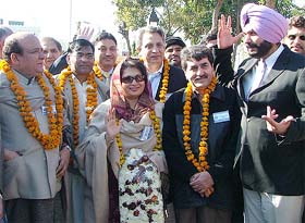 Members of the South Asian Free Media Association at the Wagah check post on Thursday. Also seen in the picture Mr Navjot Singh Sidhu, MP, Amritsar