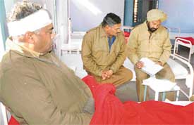 Policeman Ram Sharan (left) was injured during a fracas by Territorial Army aspirants during a recruitment rally 