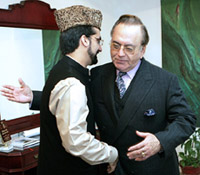 Foreign Minister Khurshid (right) hugs Mirwaiz Umar Farooq, a senior leader of Kashmirs main separatist alliance, APHC, prior to their meeting in Islamabad on Friday.
