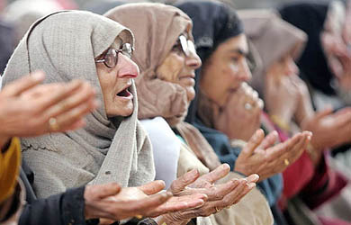 Muslims pray at the shrine of Mir Syed Ali Hamdani, a Sufi saint, during a festival in Srinagar on Saturday. Hundreds of Sufi Muslim devotees thronged the shrine of Saint Hamdani, who travelled to Kashmir from Iran to spread Islam in the region, for his 640th birth anniversary. 