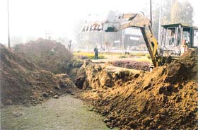 Earth dug out from a park maintained by the Canal View Apartment Welfare Society by PSEB officials for erecting towers