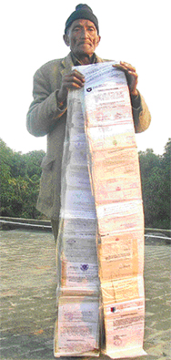 Nathi Prasad Nainwal, an ex-serviceman, shows copies of acknowledgements given by different departments in support of his padyatra.
