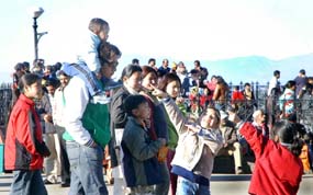 Tourists enjoy a sunny Sunday on the Ridge in Shimla.