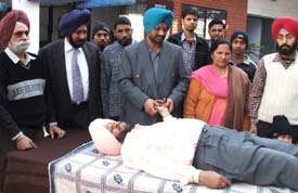 A doctor examines a person at a medical camp organised by the District Sainik Welfare Board at Sainik Rest House in Ludhiana on Sunday